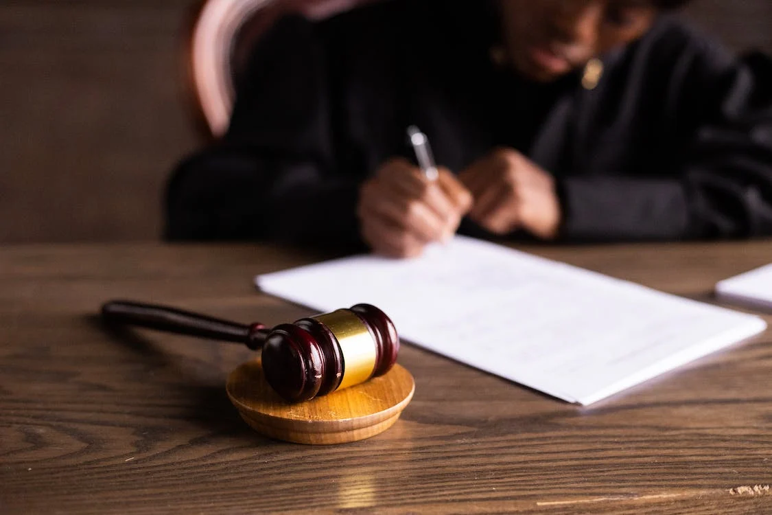 judge for personal injury case writing on document
