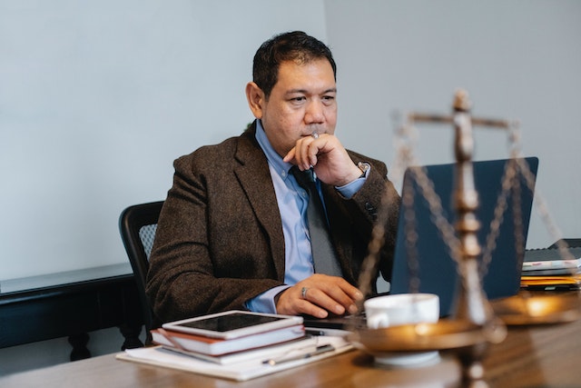 lawyer sitting at desk doing research for an accident claim