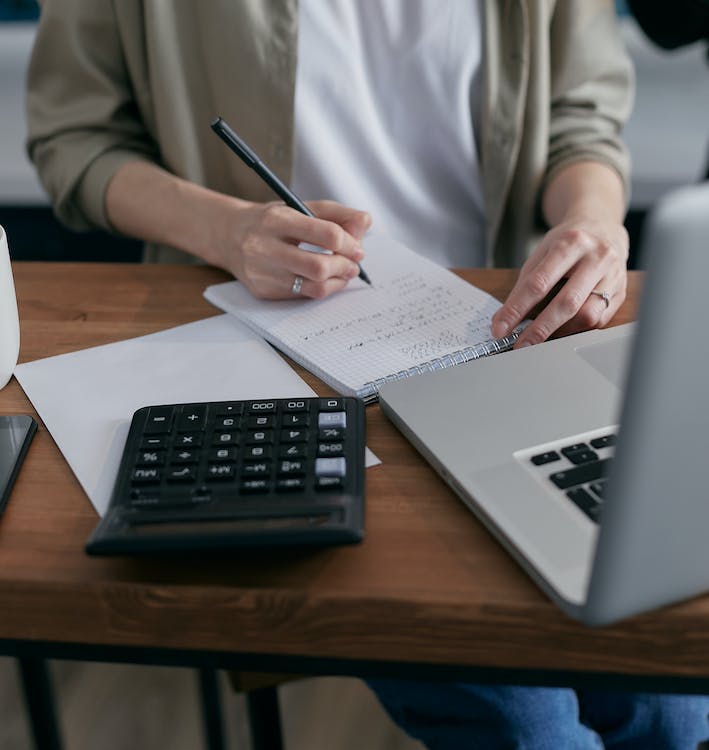 woman calculating the taxability of her settlement