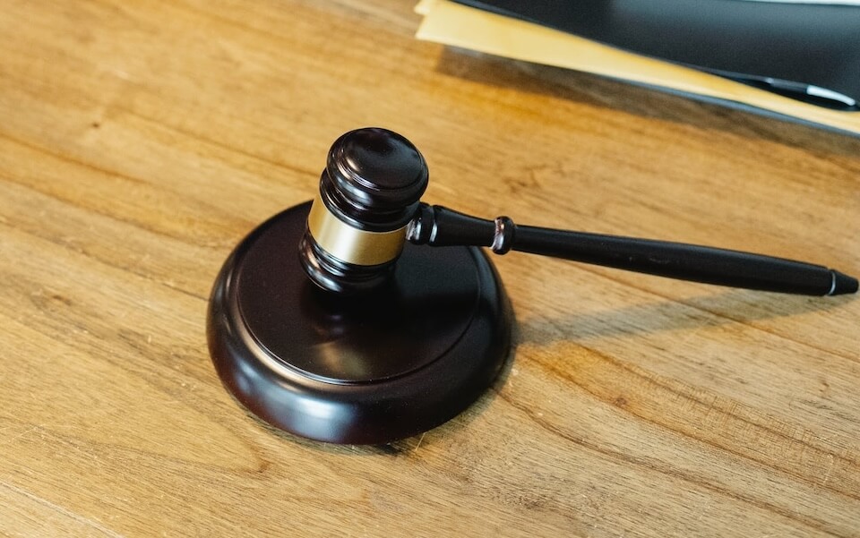 wooden gavel on wooden surface