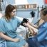 nurse measuring patient’s blood pressure