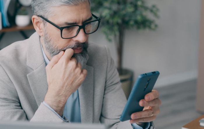 man reading from phone
