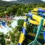 An aerial view of a waterpark with a large, swirling, yellow and blue slide