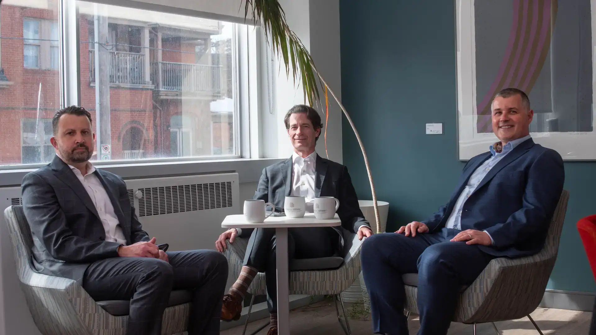 McNally Gervan lawyers sitting together in their Ottawa office